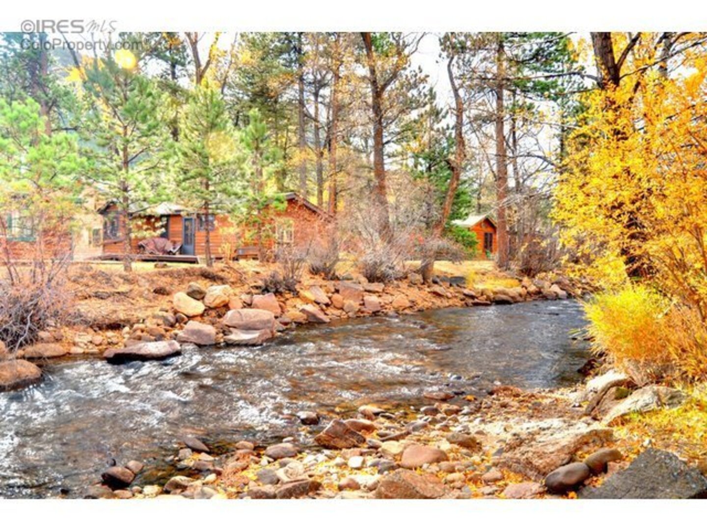 View of cabin across the river